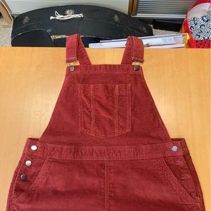 Boden corduroy jumper with overall fasteners on top. Size 14 US. Only worn once!